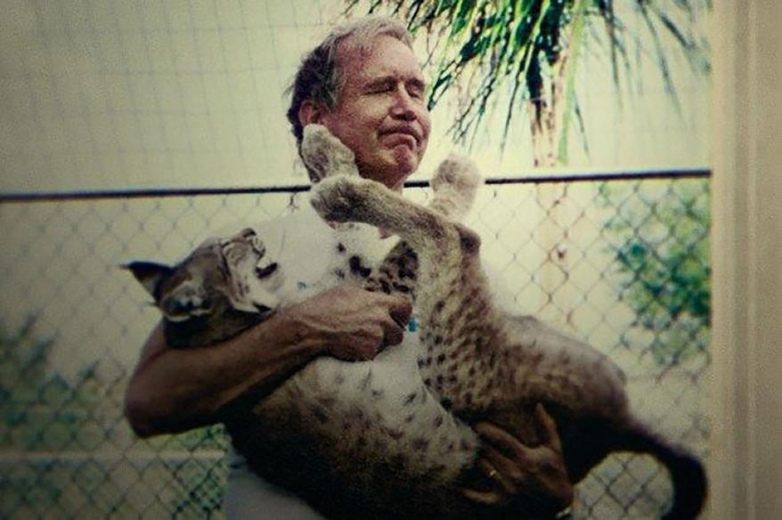 Don Lewis with a big cat.