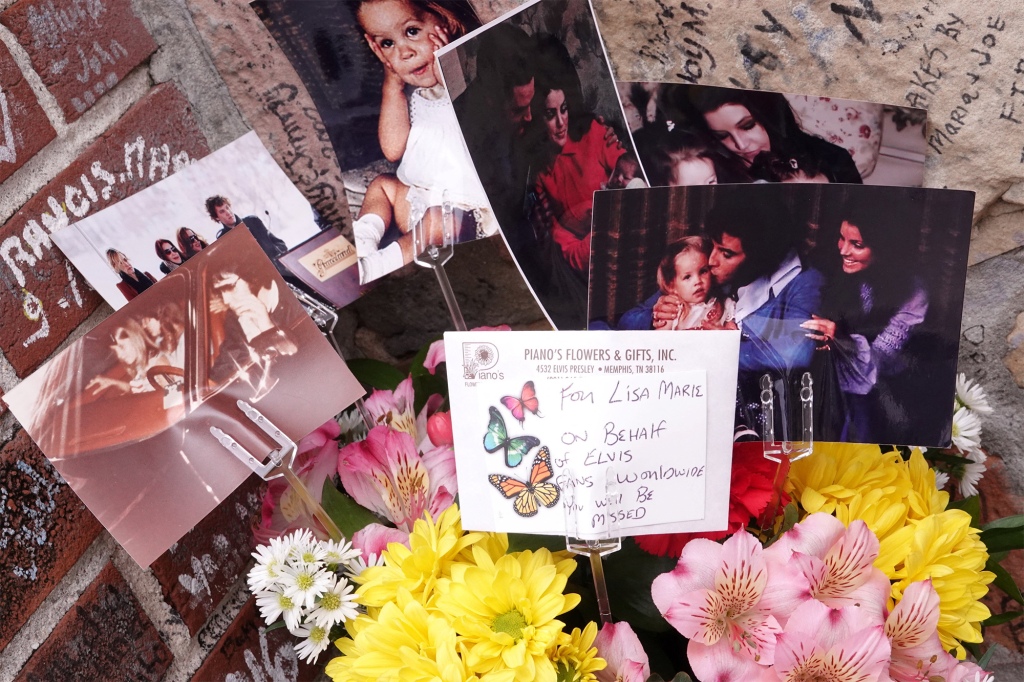 Flowers and photographs are see as music fans pay their respect in memory of singer Lisa Marie Presley.