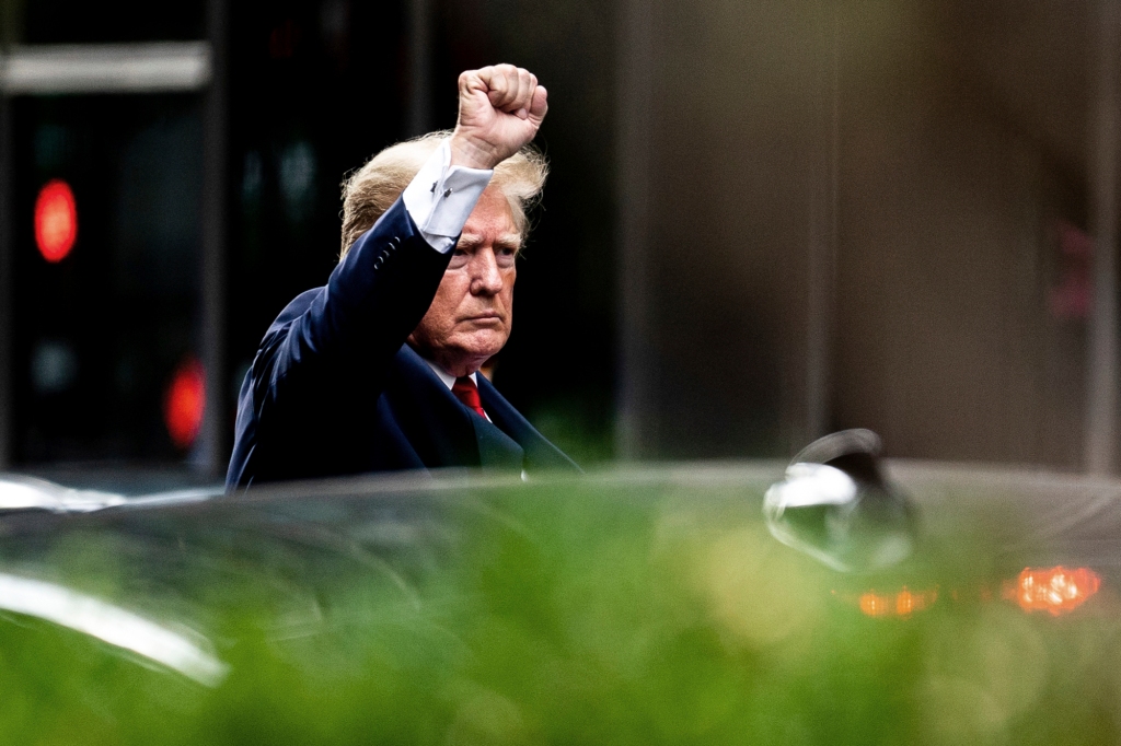 Former President Donald Trump gestures as he leaves the Trump Tower for a deposition Aug. 10, 2022, for state Attorney General Letitia James' civil investigation.