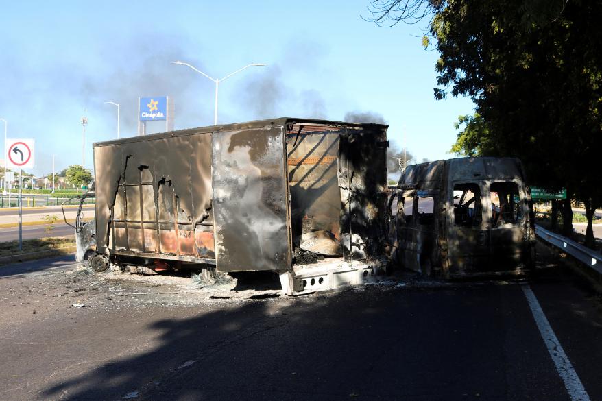 Cartel members reportedly set fire to vehicles after Guzmán was arrested.