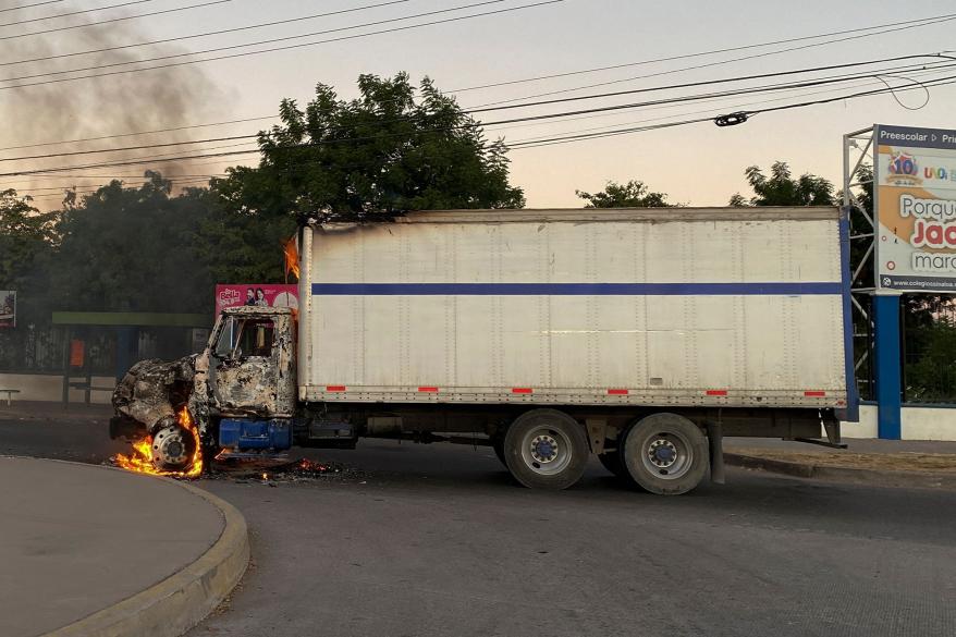 Cartel members reportedly set fire to vehicles after Guzmán Lopez was arrested.