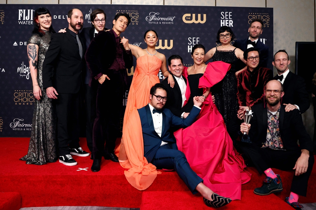 Directors Daniel Kwan and Daniel Scheinert pose with actors Harry Shum Jr., Stephanie Hsu, Michelle Yeoh, Ke Huy Quan and cast in the press room after winning the award for Best Picture for "Everything Everywhere All at Once" during the 28th Annual Critics Choice Awards at the Fairmont Century Plaza Hotel in Los Angeles, California on January 15, 2023. (Photo by Michael TRAN / AFP) (Photo by MICHAEL TRAN/AFP via Getty Images)
US-ENTERTAINMENT-FILM-AWARD-CRITICS CHOICE-PRESS ROOM