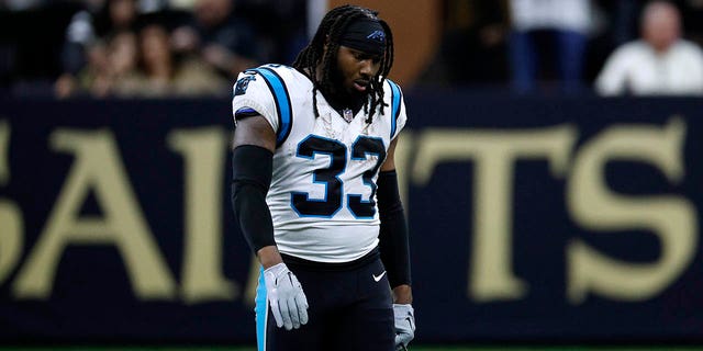 D'Onta Foreman (33) of the Carolina Panthers reacts after being disqualified during the third quarter against the New Orleans Saints at Caesars Superdome Jan. 8, 2023, in New Orleans. 