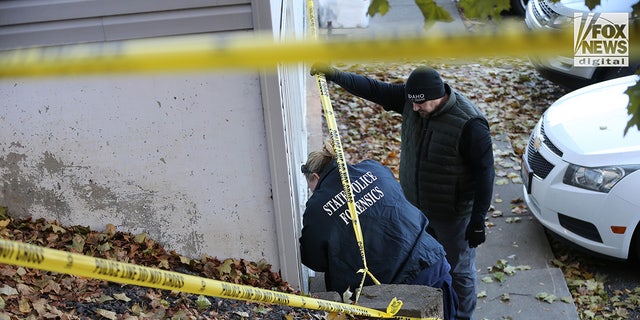 A state police forensics team looks for clues in Moscow, Idaho on Monday, Nov. 21, 2022. Four University of Idaho students were slain in the house on Nov. 13.