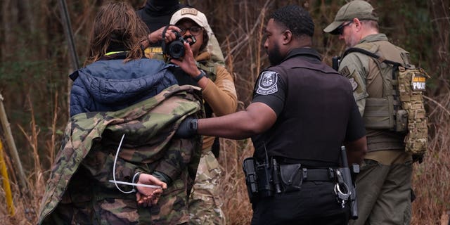 Four individuals were arrested on Wednesday morning near the site of the new police training facility. 