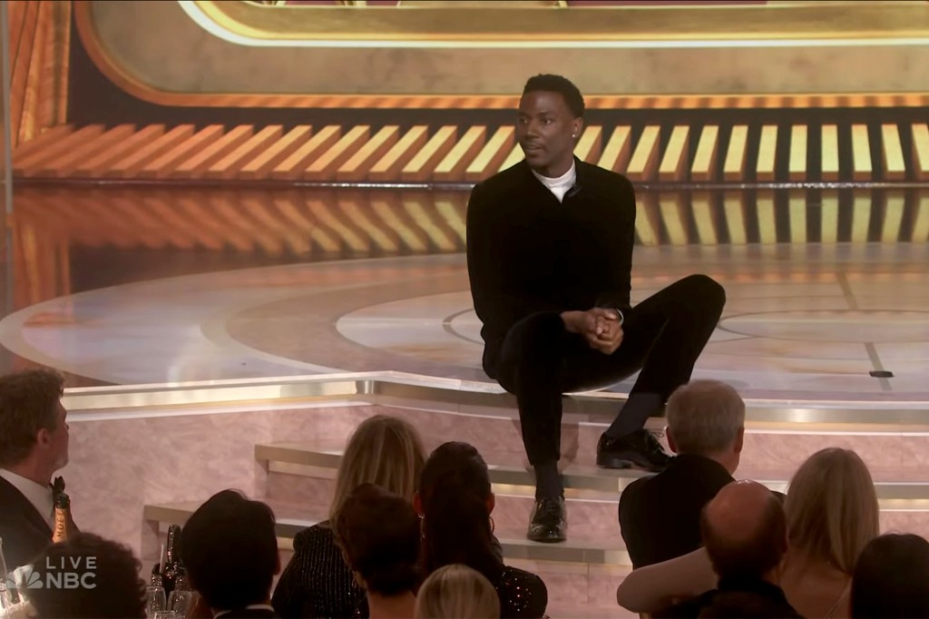 The host casually took a seat on the Golden Globes stage during his opening monologue.