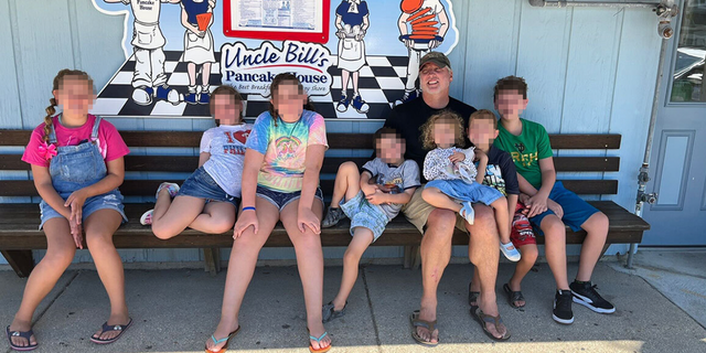 A family photo of Mark Houck, a pro-life activist arrested by the FBI, with his children.