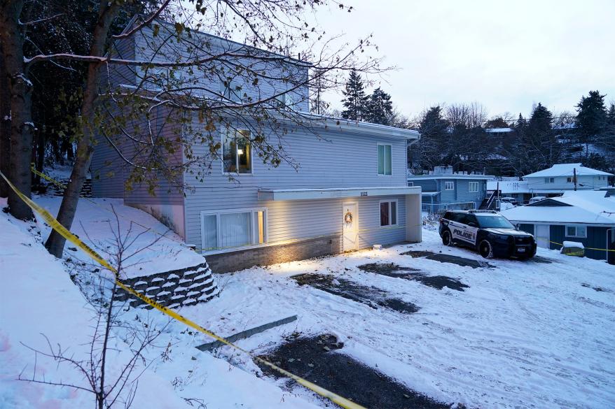 FILE - Bare spots are seen on Nov. 29, 2022, in the snowy parking lot in front of the home where four University of Idaho students were found dead on Nov. 13, in Moscow, Idaho, after vehicles belonging to the victims and others were towed away earlier in the day. Idaho Police investigating the stabbing deaths of the students say they're working with law enforcement in Eugene, Ore., to determine if a white sedan found on the side of the road there is related to the Idaho case. (AP Photo/Ted S. Warren, File)