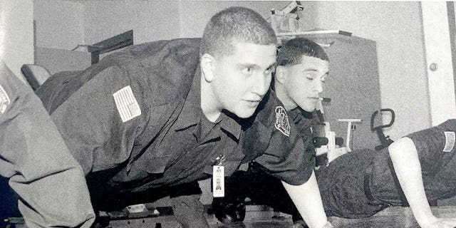 A yearbook photo of Bryan Kohberger in a high school law enforcement class doing a push-up. 