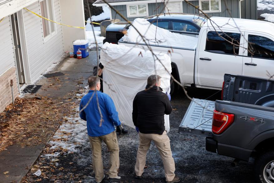 Officials from multiple agencies loaded the mattresses into the back of a truck.