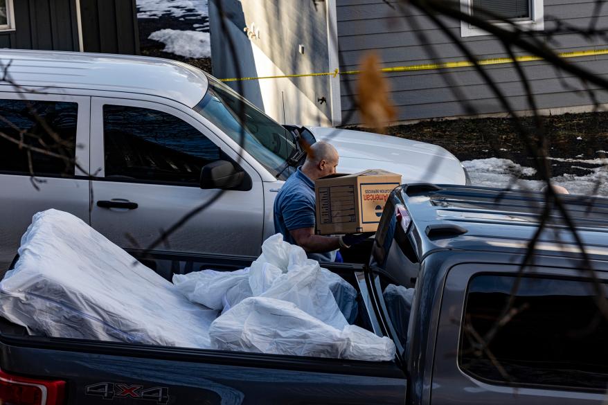 Police and forensics units came to remove bedding, blood-stained mattresses, furniture and personal effects from 1122 King Road in Moscow,