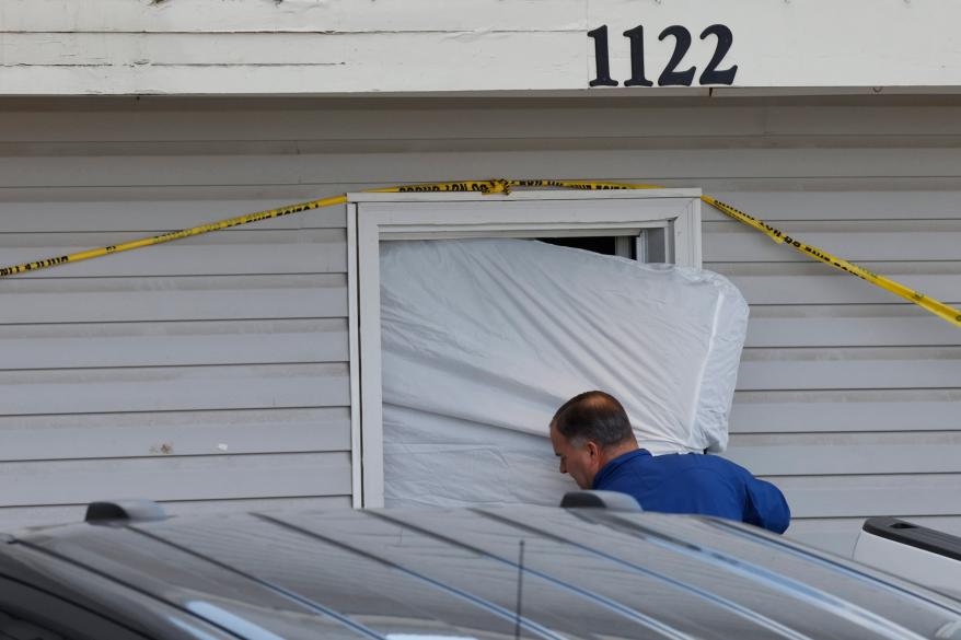 Police and forensics units came to remove bedding, blood-stained mattresses, furniture and personal effects from 1122 King Road in Moscow,