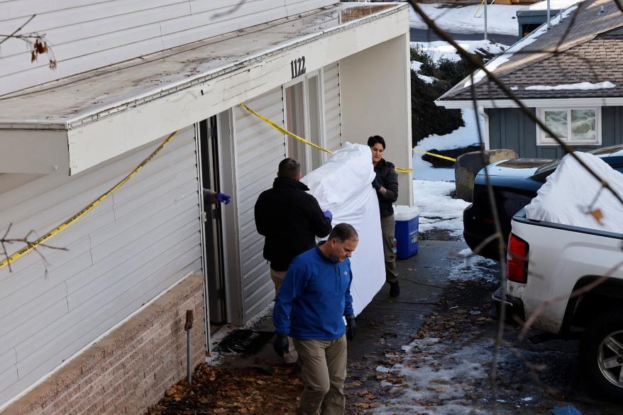 Officials from multiple agencies loaded the mattresses into the back of a truck.