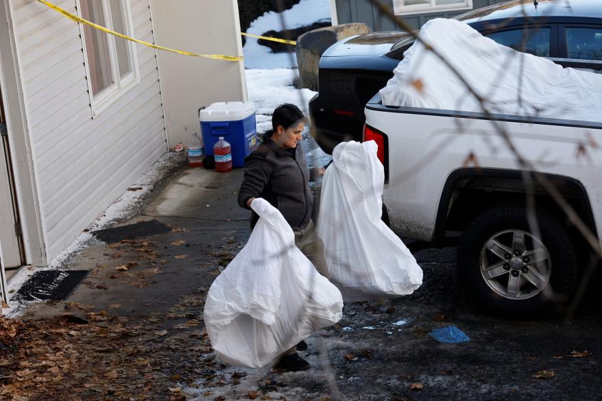 Police and forensics units came to remove bedding, blood-stained mattresses, furniture and personal effects from 1122 King Road in Moscow,