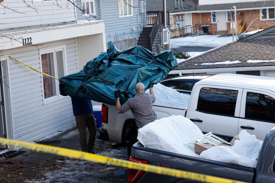 Officials from multiple agencies loaded the mattresses into the back of a truck.