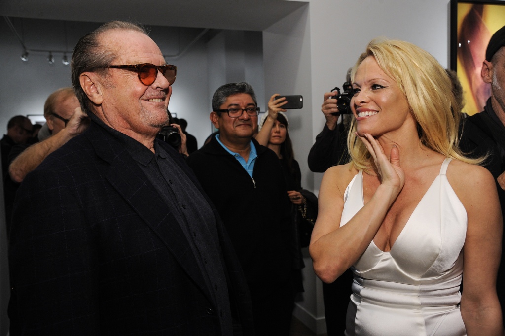 Anderson (right) wrote in her forthcoming memoir, "Love, Pamela," that she caught Jack Nicholson (left) with "two beautiful women with him" in a bathroom at the mansion.