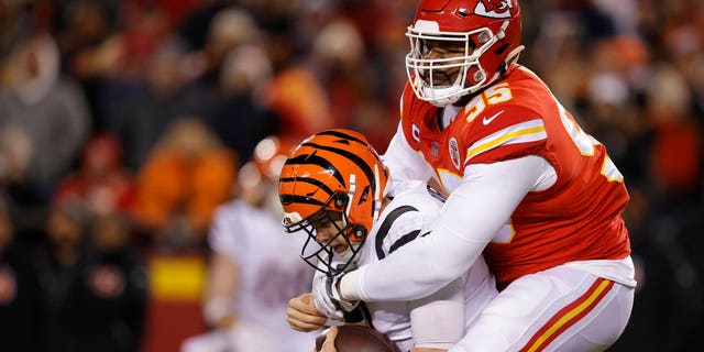 Chris Jones #95 of the Kansas City Chiefs sacks Joe Burrow #9 of the Cincinnati Bengals during the first quarter in the AFC Championship Game at GEHA Field at Arrowhead Stadium on January 29, 2023 in Kansas City, Missouri.