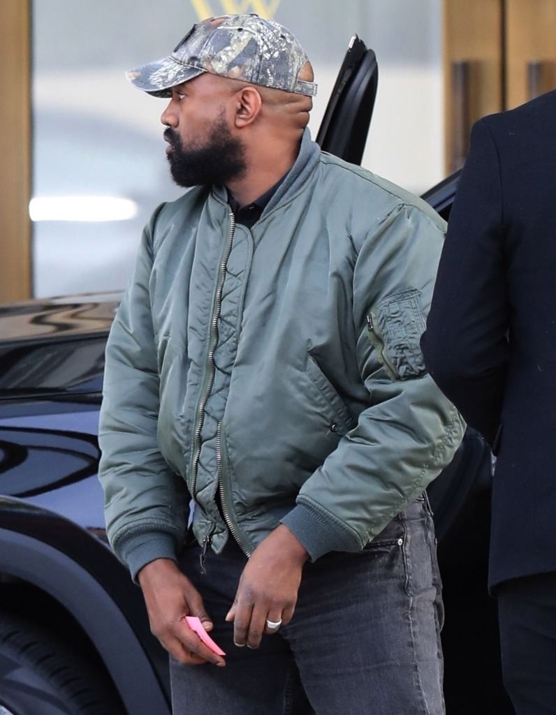 Kanye West in green bomber jacket and ring