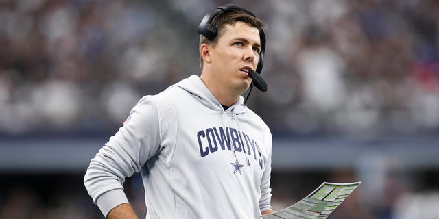 Dallas Cowboys offensive coordinator Kellen Moore looks on against the Detroit Lions during the first half at AT&amp;amp;T Stadium on October 23, 2022 in Arlington, Texas.