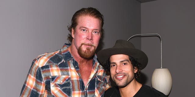 Wrestler Kevin Nash, left, and actor Adam Rodriguez pose for a photo during the Matt Bomer Spotlight Award Tribute at Trustees Theater at the 17th Annual Savannah Film Festival presented by SCAD Oct. 26, 2014, in Savannah, Ga. 