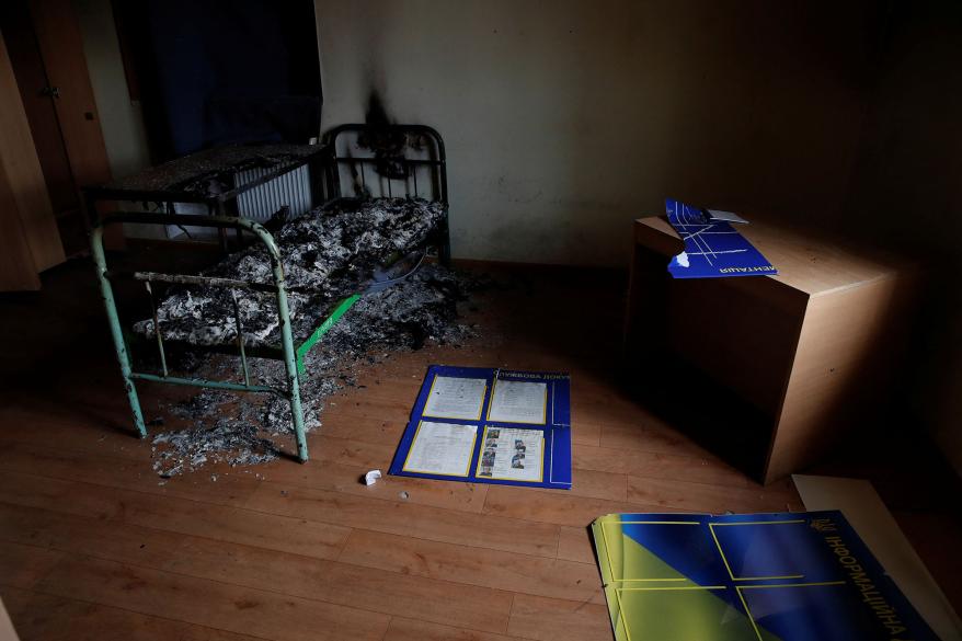 A burnt bed is seen in a cell at a preliminary detention center in Kherson.