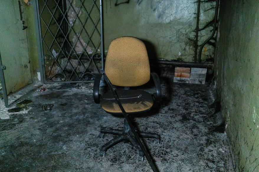 Plastic ties for torture and a broken chair are seen inside the office building in Kherson.