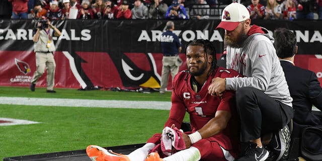 Kyler Murray #1 of the Arizona Cardinals is carted off the field after being injured against the New England Patriots during the first quarter of the game at State Farm Stadium on December 12, 2022, in Glendale, Arizona.