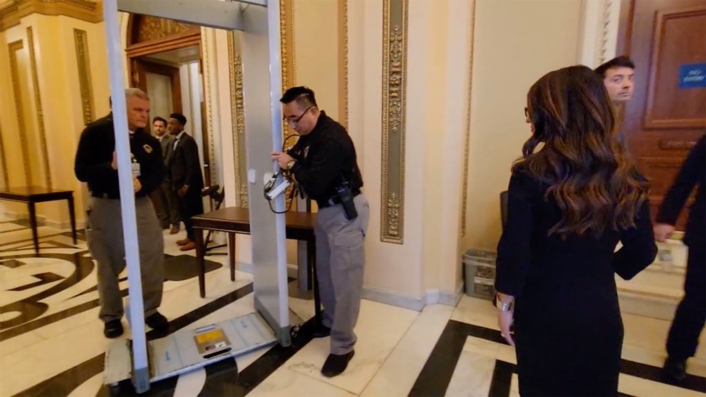 Workers remove the big walk-through metal detectors after Republicans retook power at noon Tuesday.