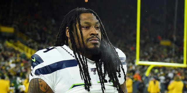 Marshawn Lynch #24 of the Seattle Seahawks looks on before the NFC Divisional Playoff game against the Green Bay Packers at Lambeau Field on January 12, 2020 in Green Bay, Wisconsin.