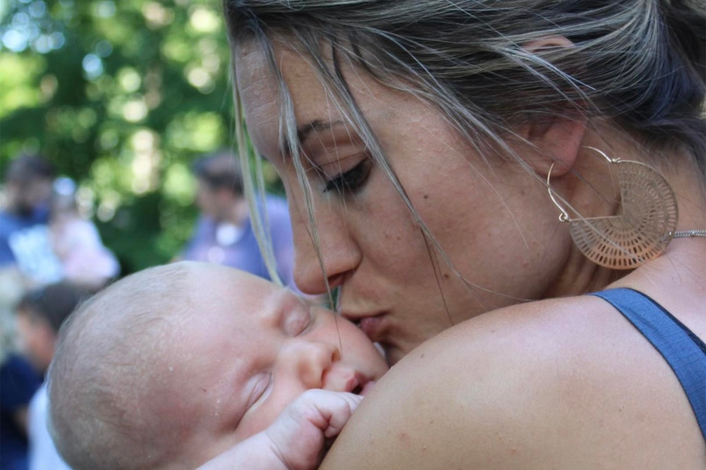 Lindsay Clancy kissing her baby