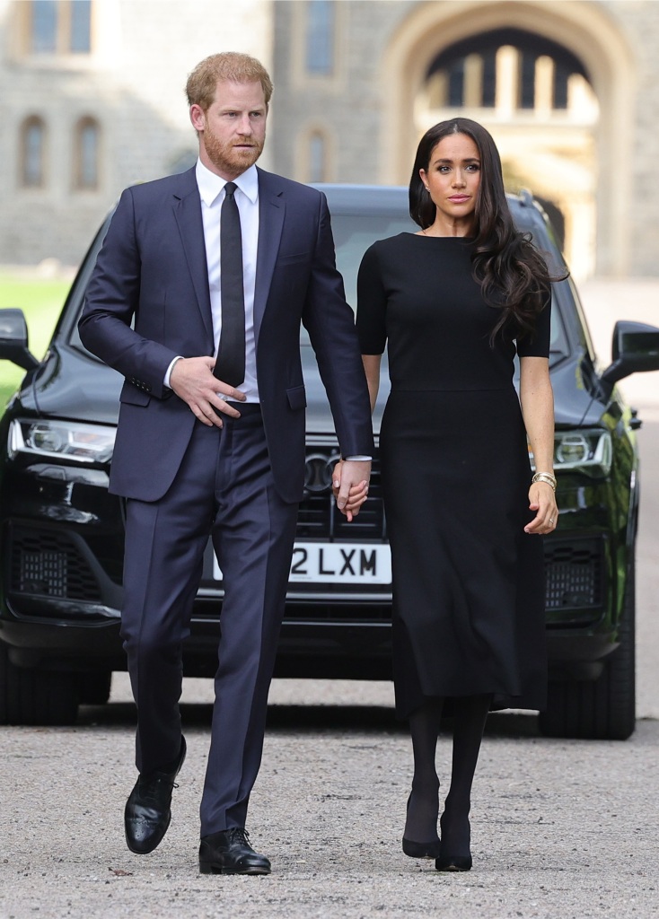 Prince Harry, Duke of Sussex, and Meghan, Duchess of Sussex arrive on the long Walk at Windsor Castle arrive to view flowers and tributes to HM Queen Elizabeth on September 10, 2022 in Windsor, England