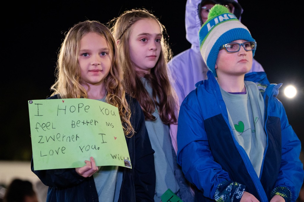 Willow Crawford, age 7, holds sign she made for teacher Abby Zwerner during a vigil on Jan. 9.