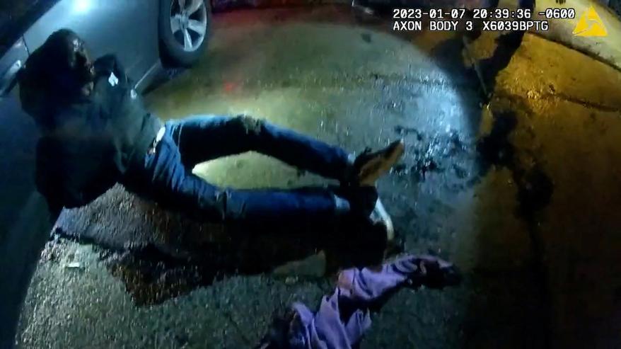 Tyre Nichols, a 29-year-old Black man who was pulled over while driving and died three days later, lays against a police car after being beaten by Memphis Police Department officers on January 7, 2023, in this still image from video released by Memphis Police Department on January 27, 2023.