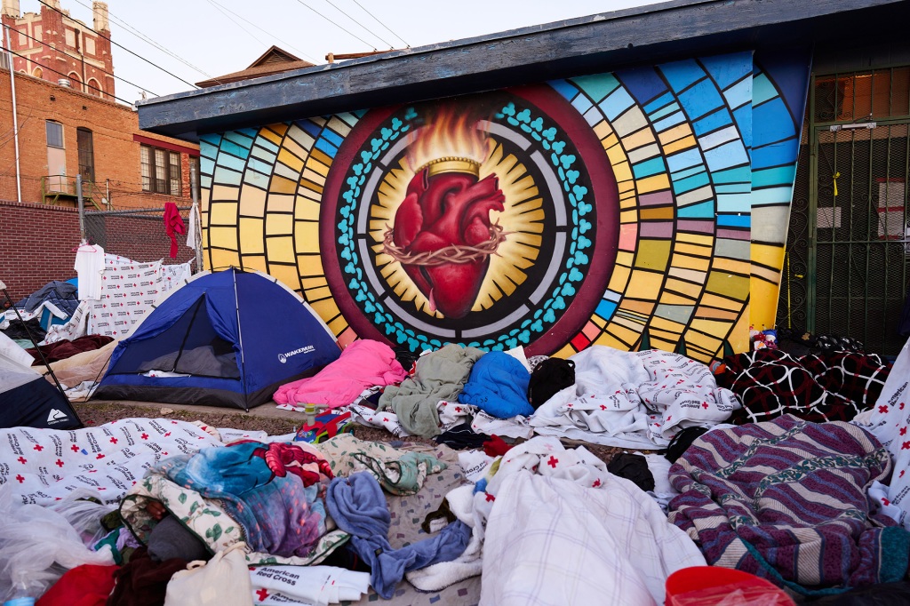 Sacred Heart Catholic Church opened its doors to migrants, but there were so many, that the overflow sleep outside on the street every night.