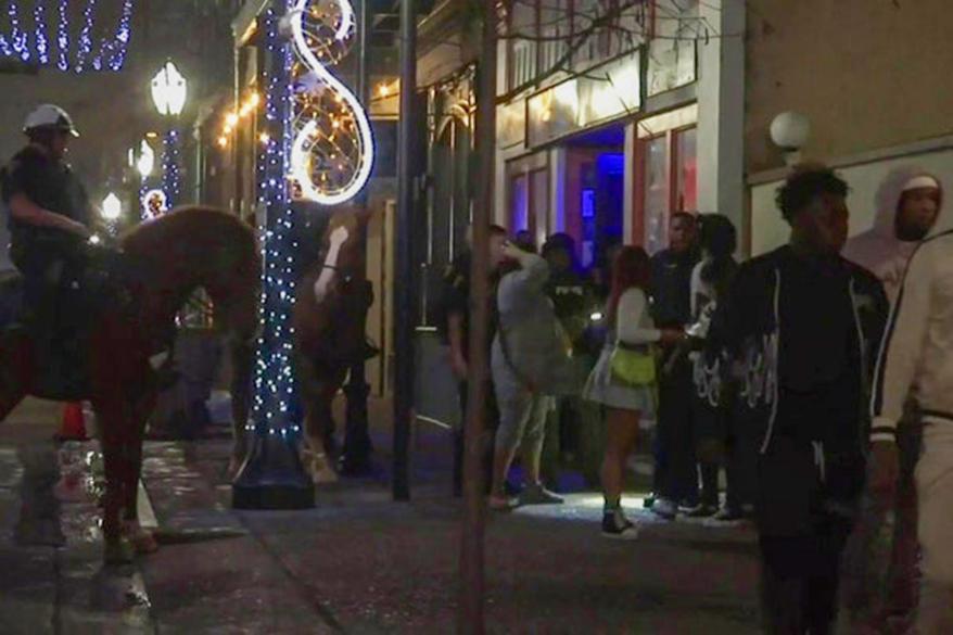 Mounted police patrol New Year's Eve celebrations in downtown Mobile.