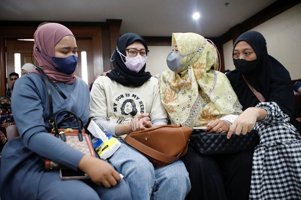 Mothers of children with acute kidney injury attending a preliminary hearing of a class-action lawsuit against the Indonesian government and drug companies over the sale of tainted cough syrup in Jakarta on January 17, 2023.