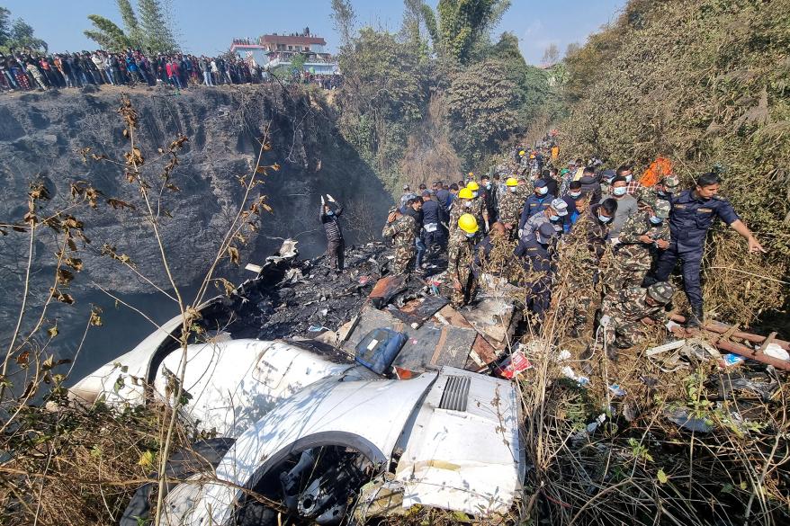 Rescue teams work to retrieve bodies at the crash site of an aircraft carrying 72 people in Pokhara in western Nepal January 15, 2023.