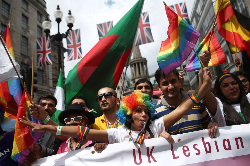 Participants take part in the annual Pride London Parade, which highlights issues of the gay, lesbian and transgender community, in London on June 25, 2016.