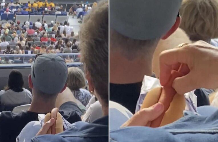 Australian Open fan causes social media stir with hot dog act