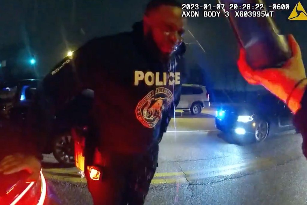Memphis PD officer squints after getting sprayed with pepper spray