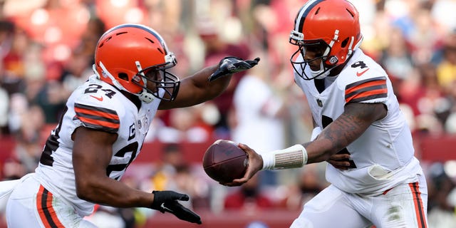 Deshaun Watson #4 of the Cleveland Browns hands the ball off to Nick Chubb #24 of the Cleveland Browns during the third quarter against the Washington Commanders at FedExField on January 01, 2023 in Landover, Maryland.