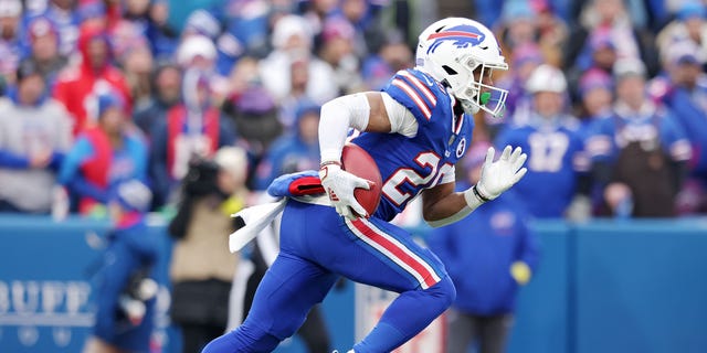 Nyheim Hines of the Buffalo Bills returns the opening kickoff for a touchdown against the New England Patriots at Highmark Stadium on Jan. 8, 2023, in Orchard Park, New York.