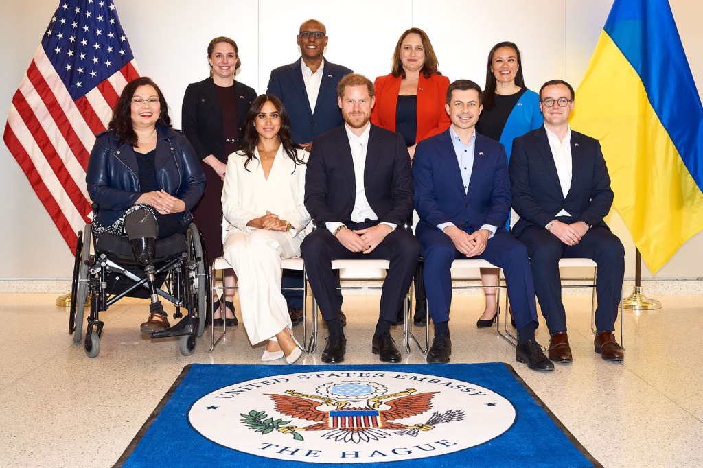 Members of the US delegation at the Invictus Games in April 2022 with officials from the Invictus Games Foundation, including Prince Harry and Meghan Markle.