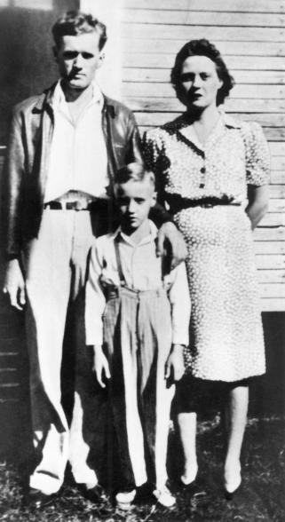 Photo of Elvis PRESLEY, as a child with his parents - L-R: Vernon Presley, Elvis Presley (as child), Gladys Presley