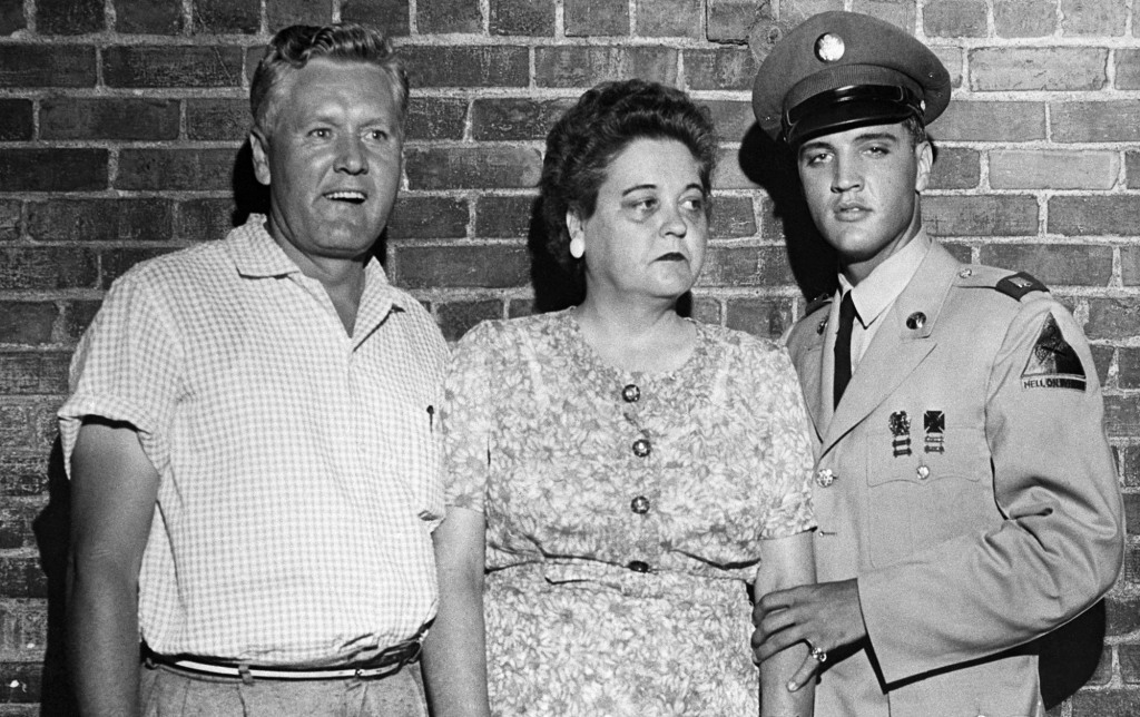 A picture of Elvis Presley, on his first leave from the Army, escorts his parents, Mr. and Mrs. Presley.