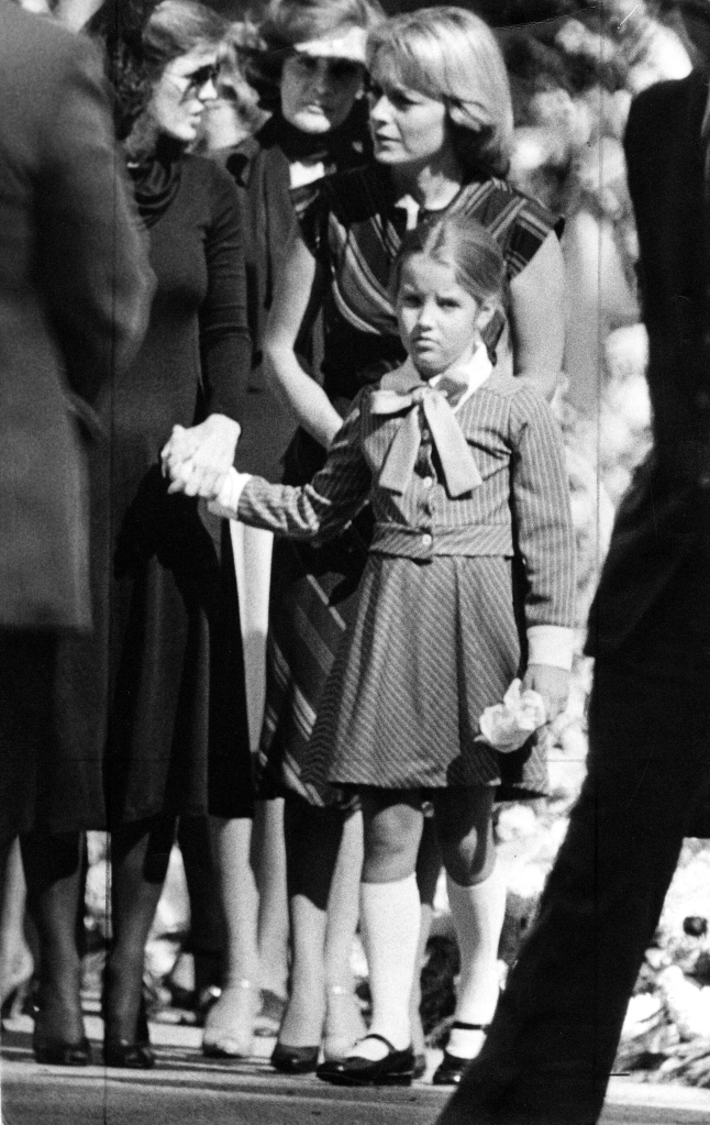 Priscila Presley and Lisa Marie at Elvis Presley’s funeral in 1977.
