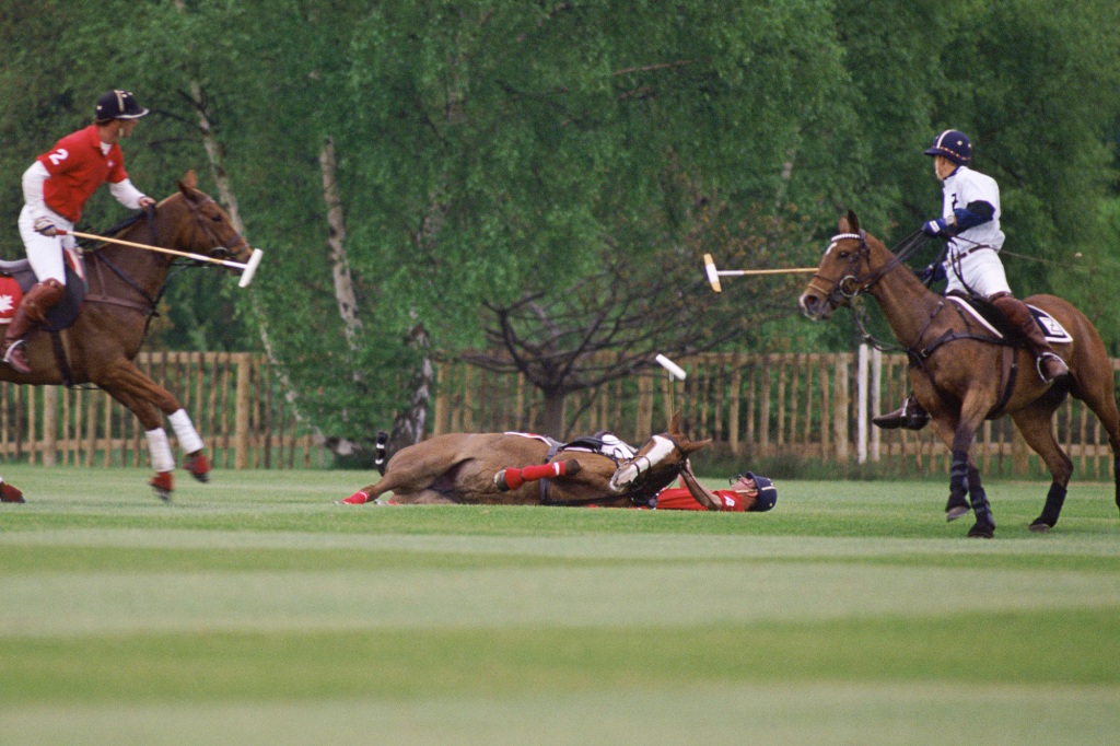 Prince Charles falls from his polo pony during a match at Smiths Lawn in Windsor.