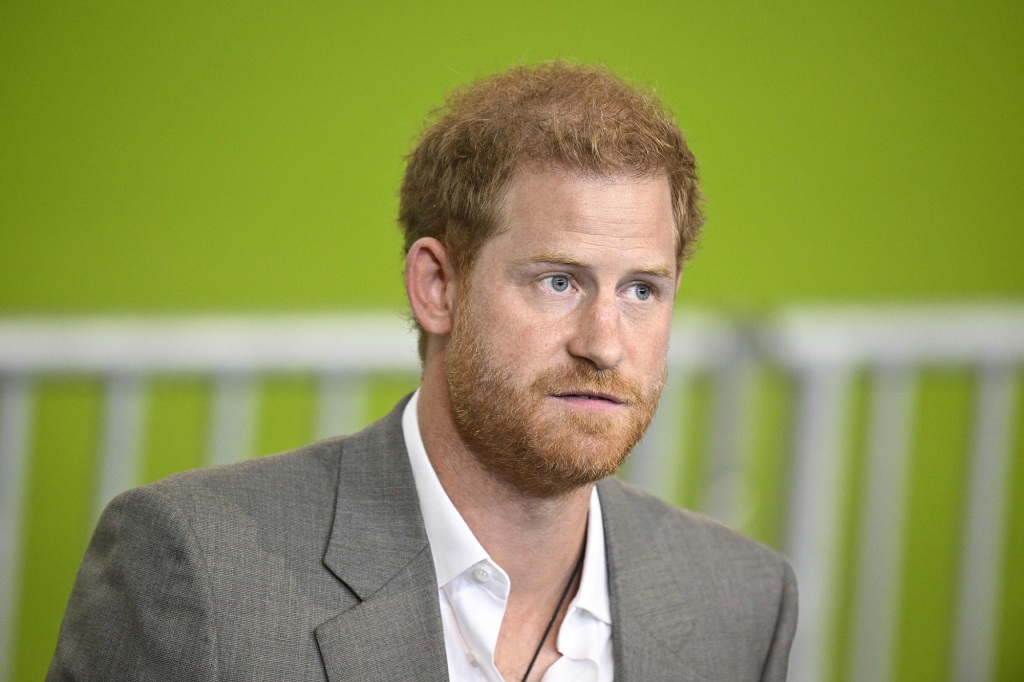 Prince Harry looking serious. 