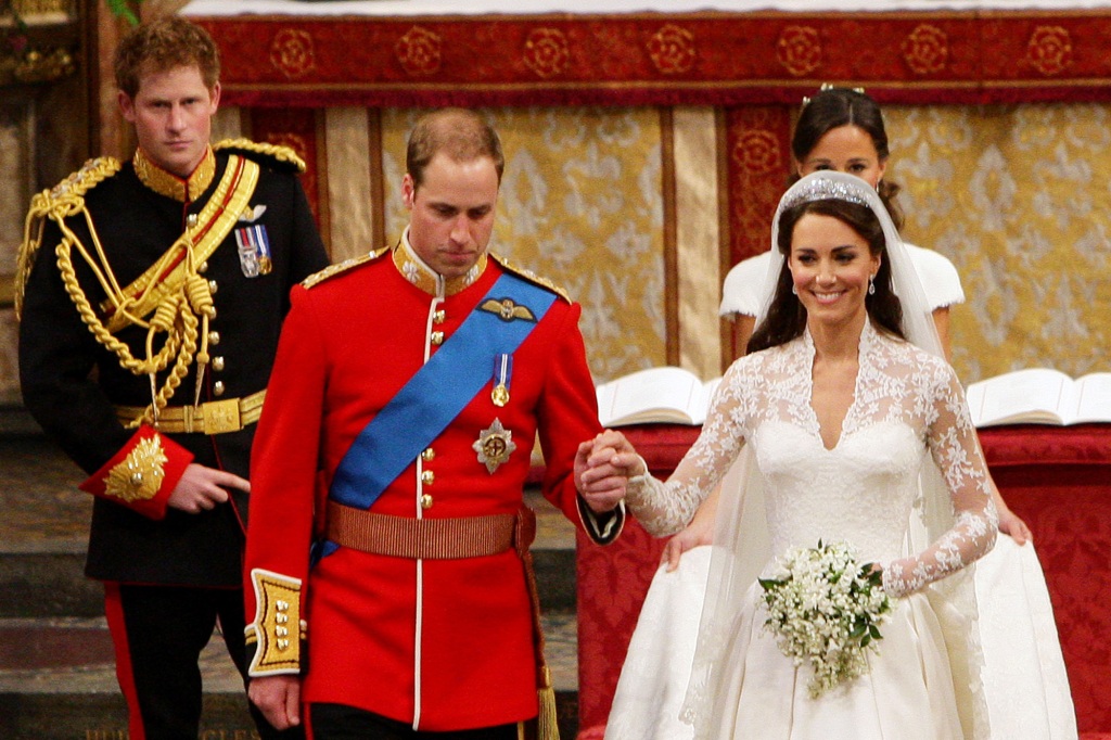 Britain's Prince William (foreground L) and his wife Kate, Duchess of Cambridge (foreground R), accompanied by best man Britain's Prince Harry (back L), and maid of honour Philippa Middleton (back R) leave Westminster Abbey in London on April 29, 2011 after their wedding.