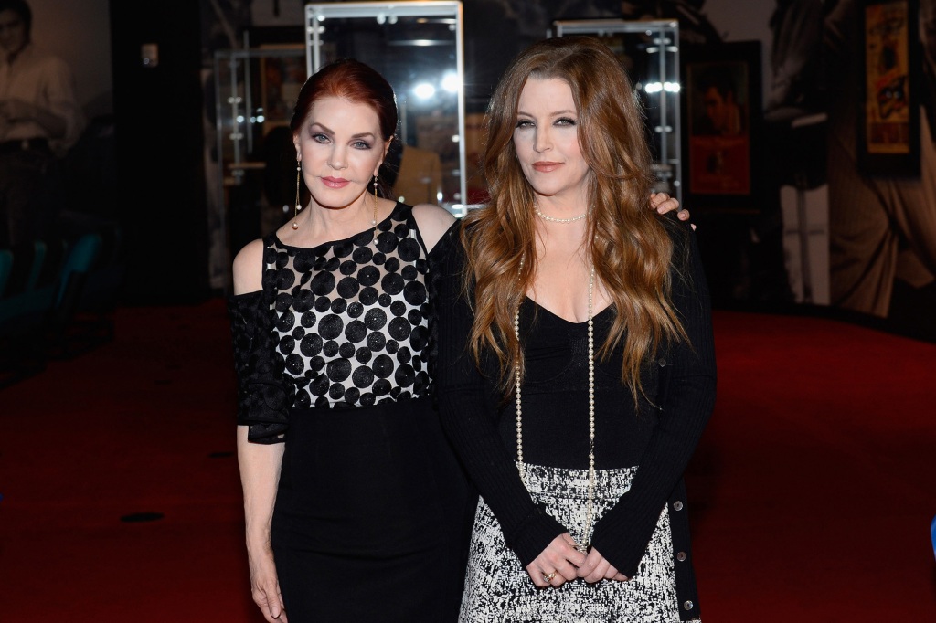 Priscilla Presley (L) and Lisa Marie Presley attend the ribbon-cutting ceremony during the grand opening of "Graceland Presents ELVIS: The Exhibition - The Show - The Experience."